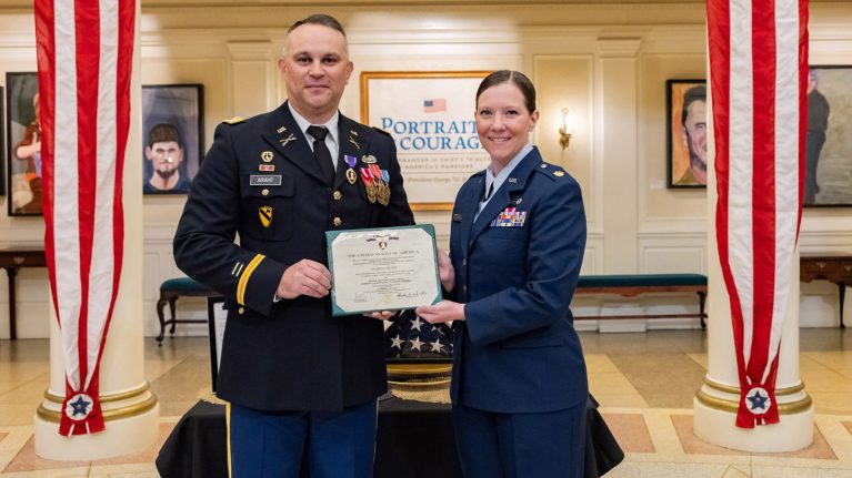Man and woman in military uniforms