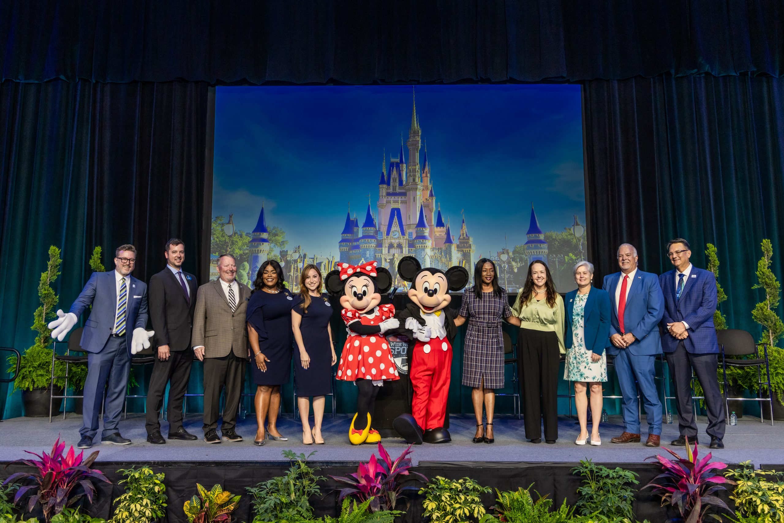 ESPN Wide World of Sports posing with Mickey and Minnie